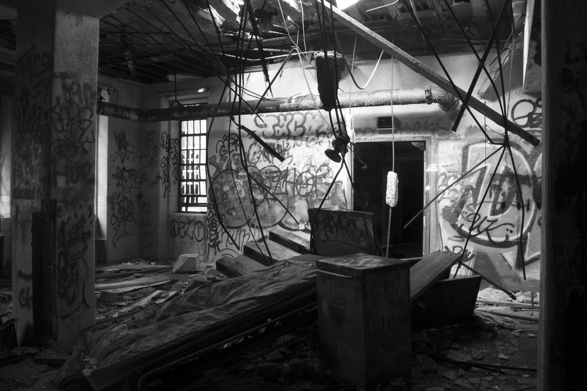 A patient's bed stands defiantly in the first floor kitchen.